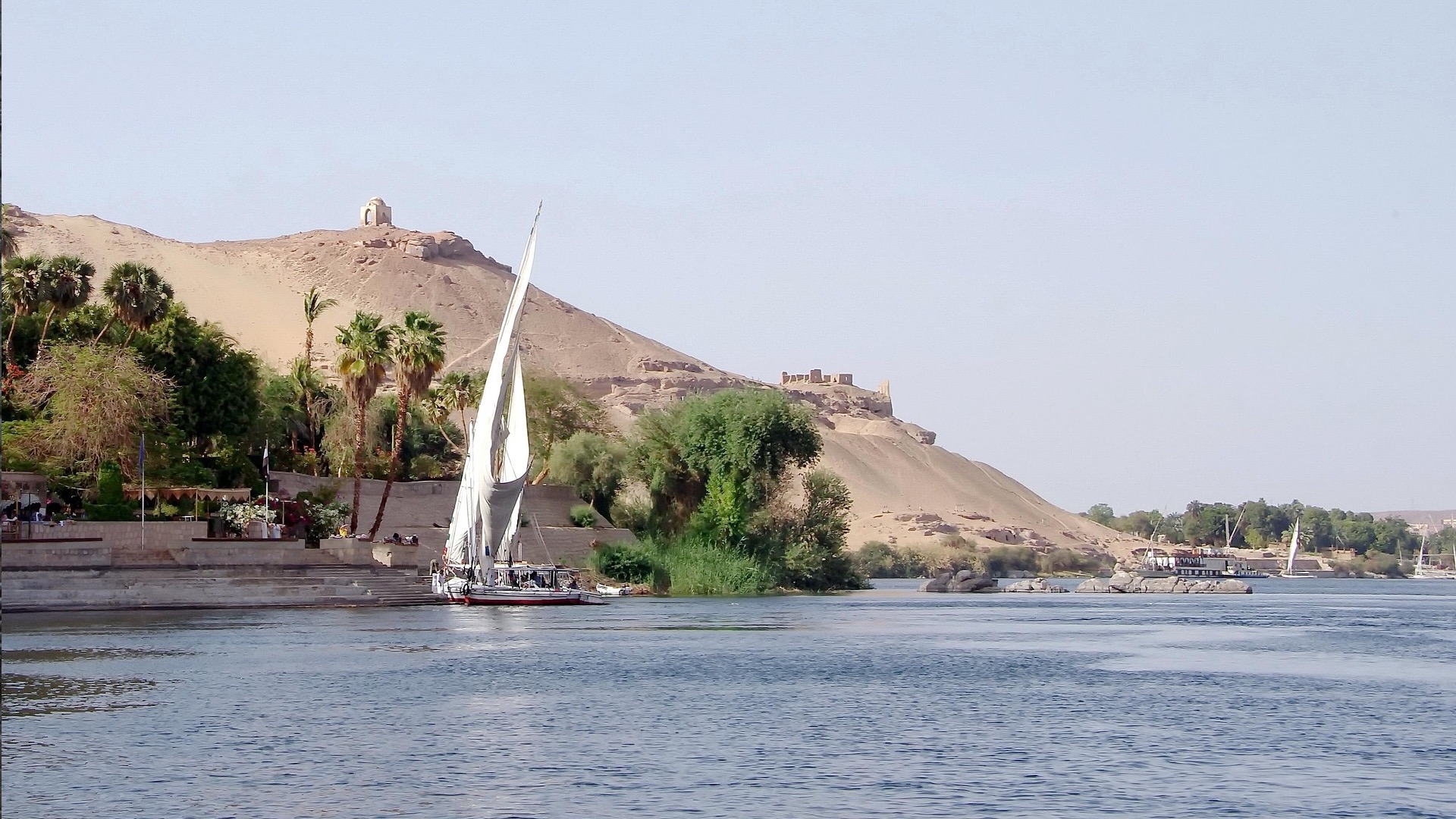 The Nile River at Aswan with feluccas and islands